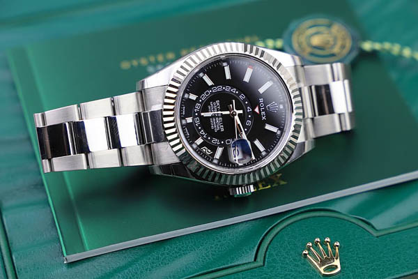 ROLEX SKY DWELLER”></P>
<P>ROLEX'S LATEST MODEL AND THE BRAND'S FIRST ANNUAL CALENDAR WATCH, THE SKY-DWELLER, WAS ADDED TO THE CATALOG IN 2012. AVAILABLE IN THREE TONES OF GOLD, TWO-TONE YELLOW GOLD AND STEEL, OR STEEL WITH A WHITE GOLD BEZEL, THE SKY-DWELLER HAS A GENEROUS SIZE OF 42 MM WITH A RIBBED BEZEL. THIS PARTICULAR ROLEX WATCH COMBINES STRIKING STYLE WITH COMPLEX MECHANICS.
<P>FIRST, AS AN ANNUAL CALENDAR, THE DATE WINDOW AND APERTURES NEXT TO THE HOUR MARKERS ADJUST AUTOMATICALLY DURING MOST OF THE YEAR AS THE MOVEMENT IS ABLE TO DISTINGUISH BETWEEN 30 AND 31 DAY MONTHS. THE ONLY TIME THE WEARER NEEDS TO MANUALLY ADJUST THE CALENDAR WINDOWS IS ON MARCH 1 DUE TO THE 28 OR 29 DAYS OF FEBRUARY. IN ADDITION TO ALL THIS, THE SKY-DWELLER ALSO HAS A SECOND TIME ZONE DISPLAYED VIA AN OFF-CENTERED 24-HOUR DISK ON THE DIAL. THE COMBINATION OF THE GMT FUNCTIONALITY AND THE ANNUAL CALENDAR MECHANISM MAKES THE SKY-DWELLER THE ULTIMATE WATCH FOR TRAVELERS.</P>